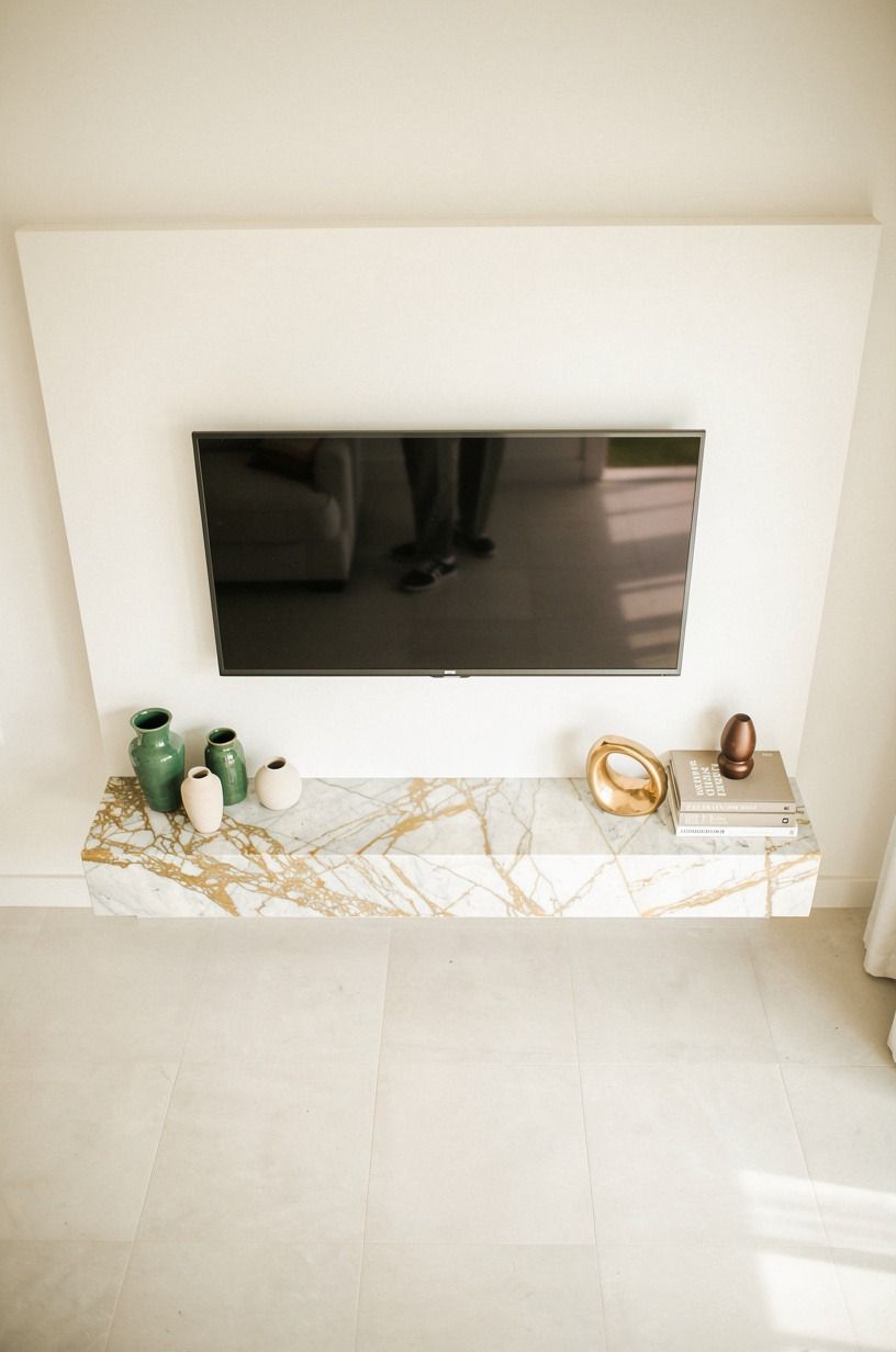 Sherwin-Williams Creamy SW 7012 Behind the TV