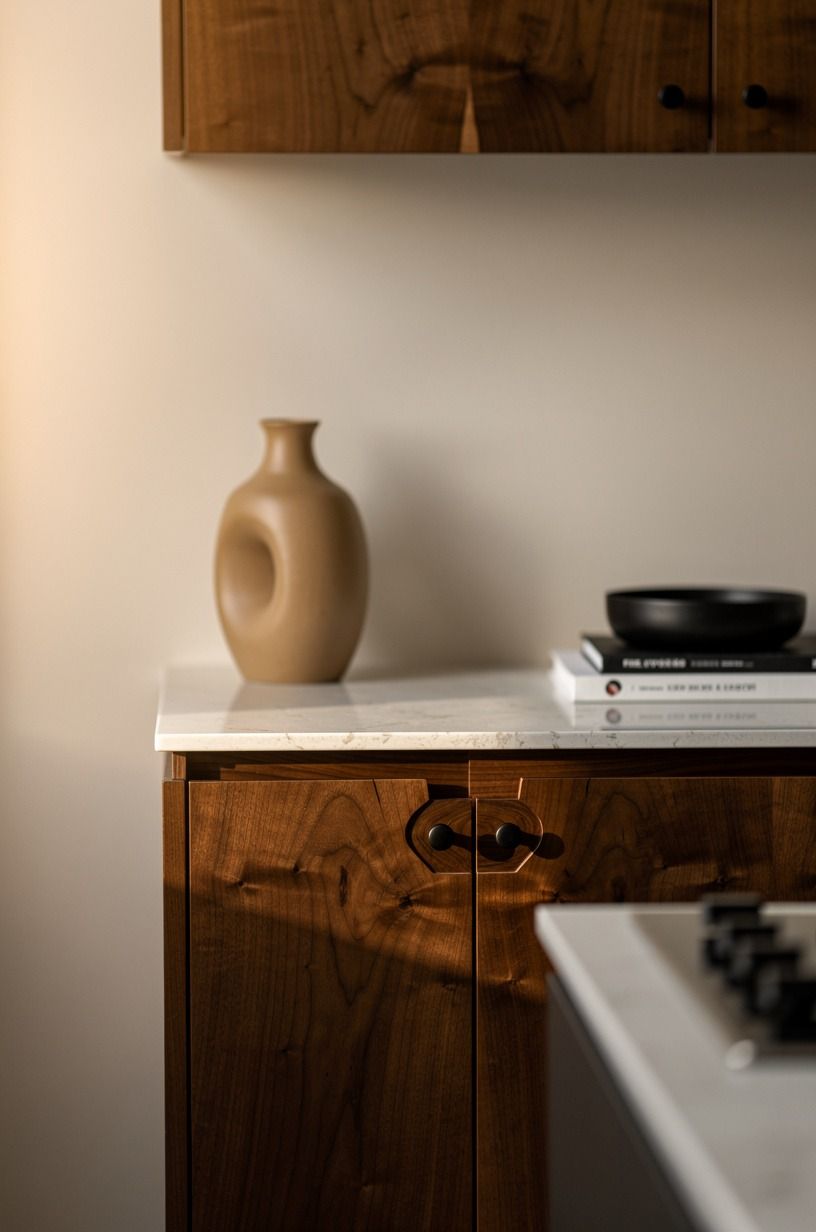 Let pale walls make the walnut feel deliberate
