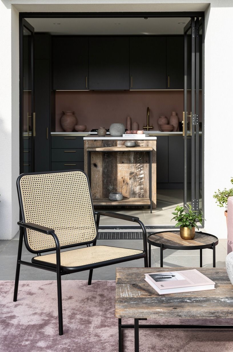 Mix Black Metal With Cane for an Airy Contrast