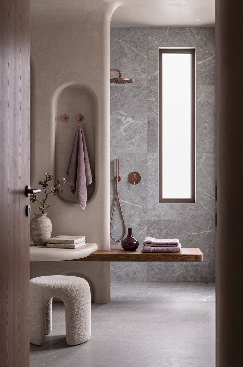 Float a teak bench beneath the marble shower with window