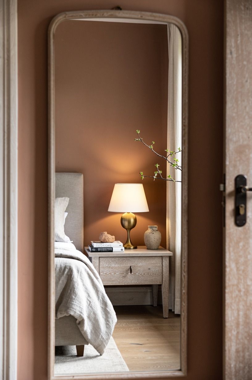 Let a Vintage Mirror Catch the Lamp Glow