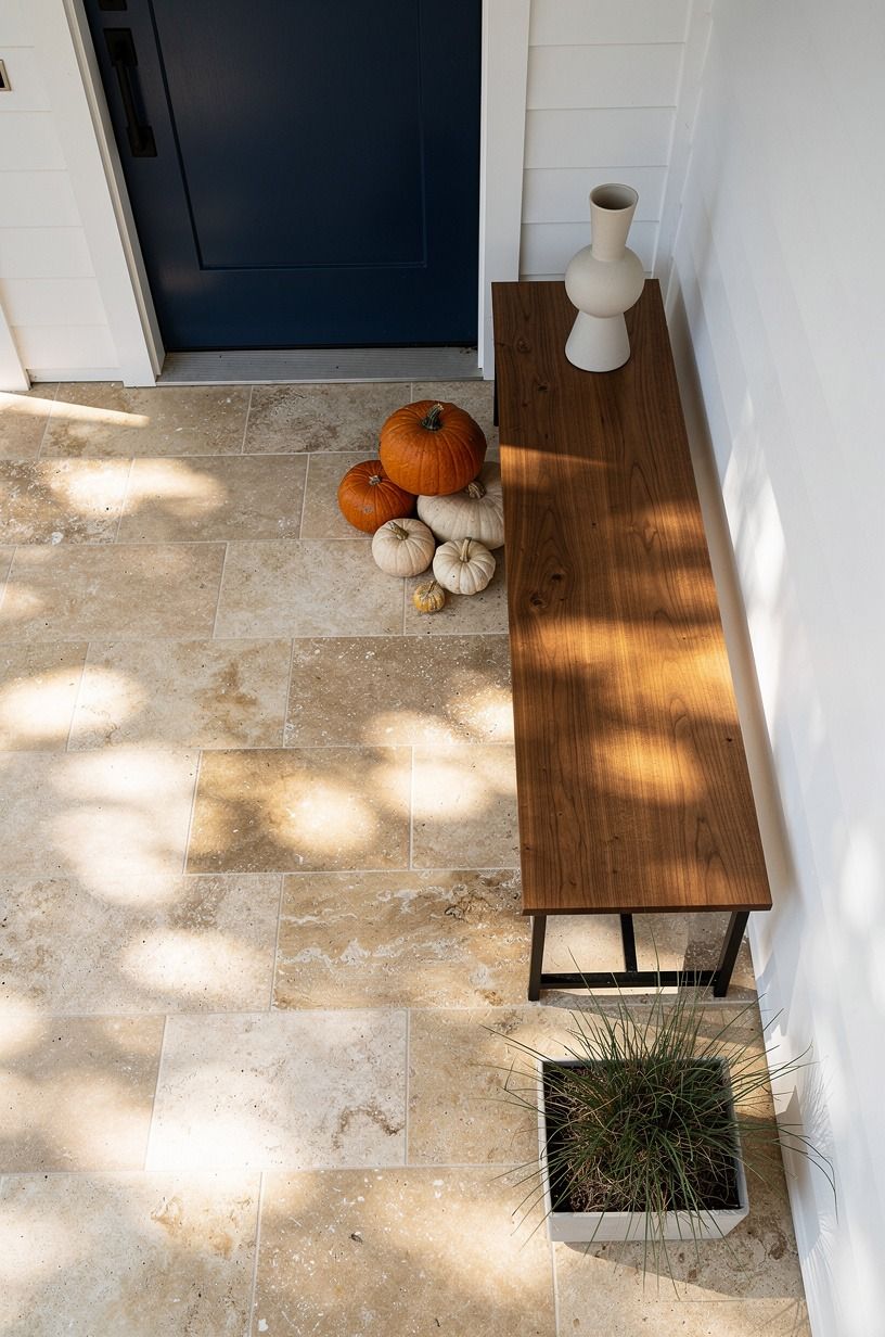 Stack Pumpkins Beside a Slim Bench