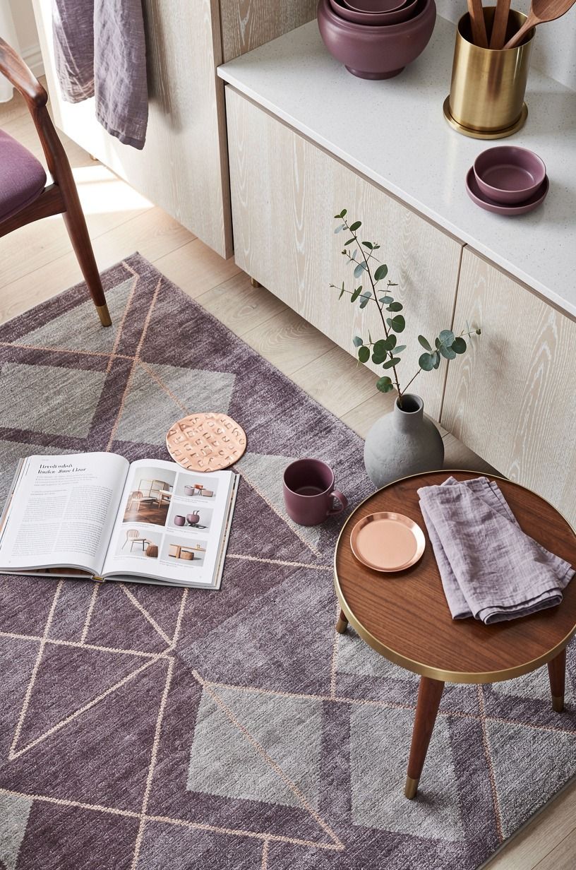 Frame the corner with a soft geometric rug