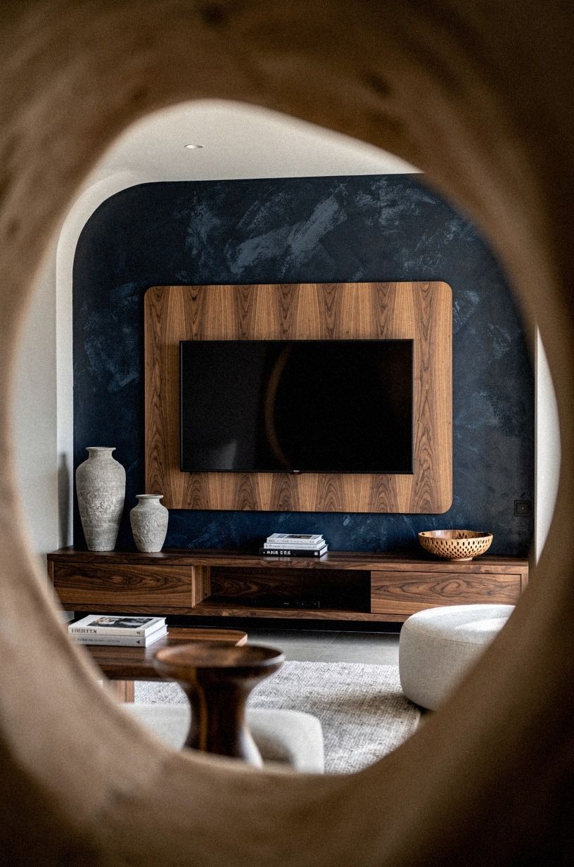 Paint behind the screen for a dramatic small TV media wall