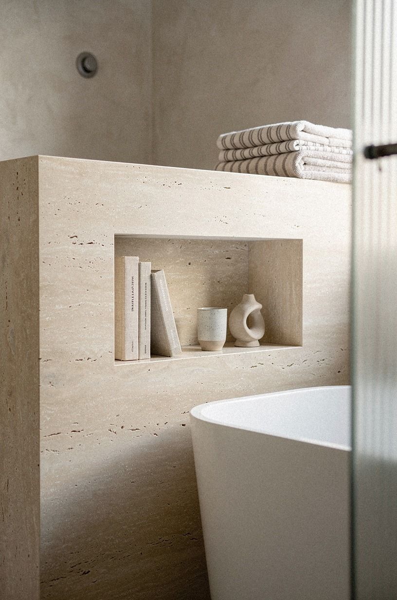 Layer a honed travertine half-wall